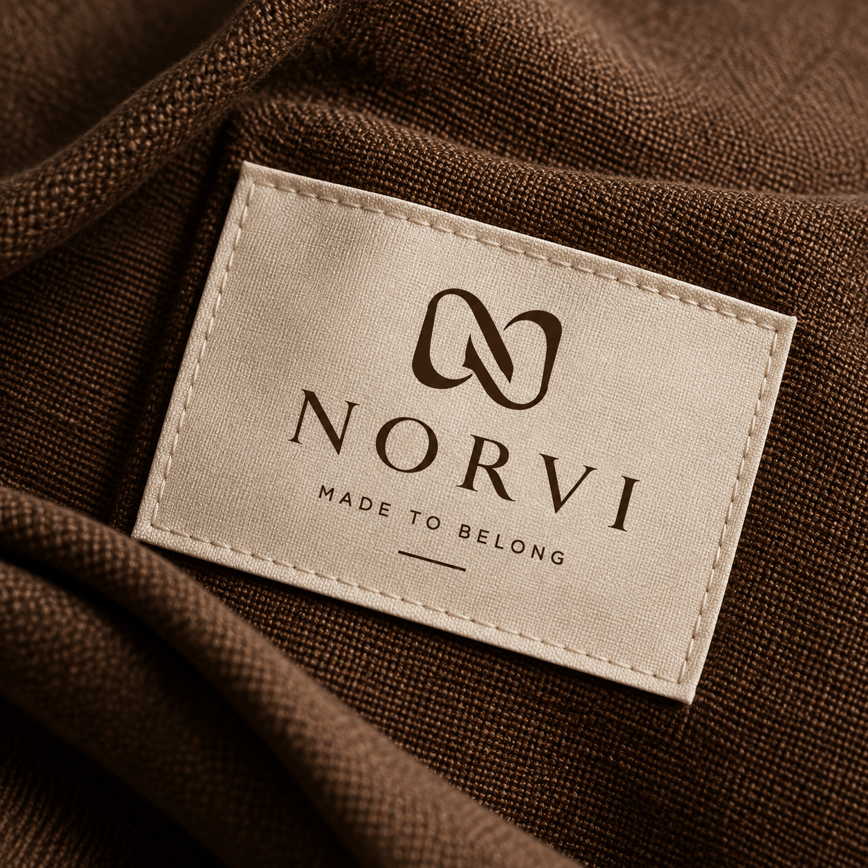 A woven NORVI label resting on linen
